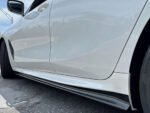 Installed pre-preg carbon fibre side skirts on BMW 8 Series G16 gloss-finish rocker extensions with OEM fitment