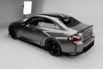side angle view of a carbon fibre body kit installed on a bmw g87 m2