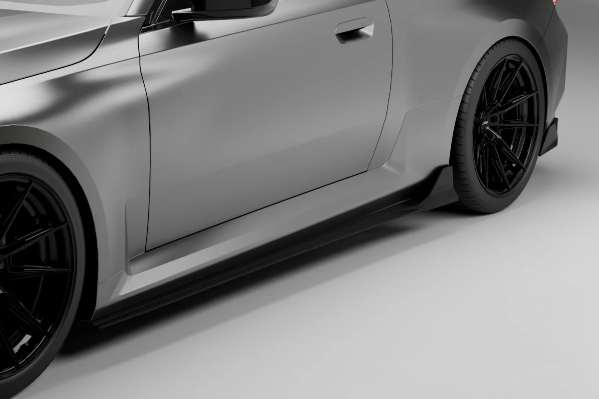 close-up of a bmw g87 m2 fitted with dry carbon fibre side skirts