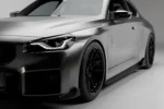 side view of the bm g87 m2 installed with carbon fibre side skirts