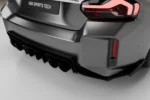 close-up of a carbon fibre rear diffusser intalled on a bmw g87 m2