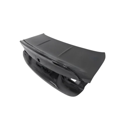 BMW G82 M4 carbon fibre CSL boot lid – angled top-left view showing dry carbon finish and CSL contours