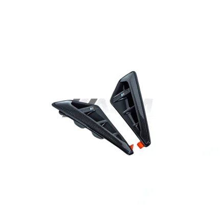 BMW X5M F95 carbon fibre side fenders M-Performance style – front angle view with gloss carbon finish and aerodynamic vents