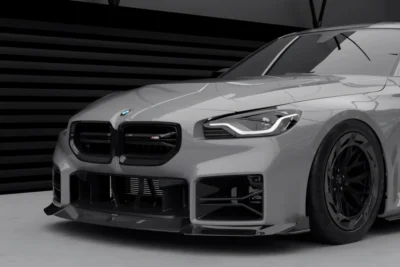 Showroom View Of Bmw G87 M2 Dry Carbon Air Ducts And Front Bumper Assembly
