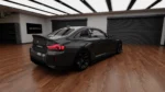 bmw g87 m2 carbon fibre rear spoiler shown from side angle with high ducktail profile and Sports Tech fitment