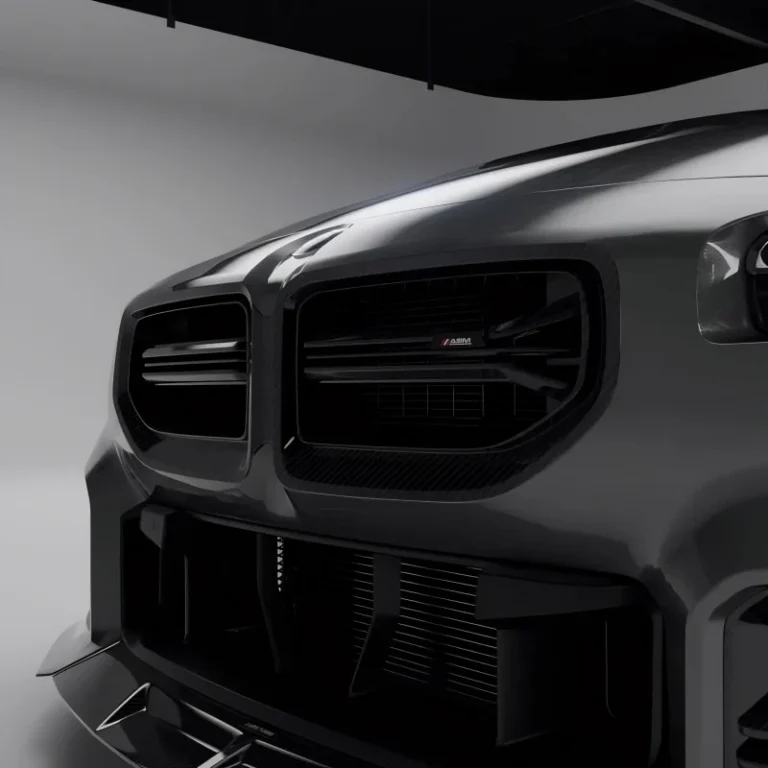 Carbon fibre front grille with ASM badge viewed from right angle