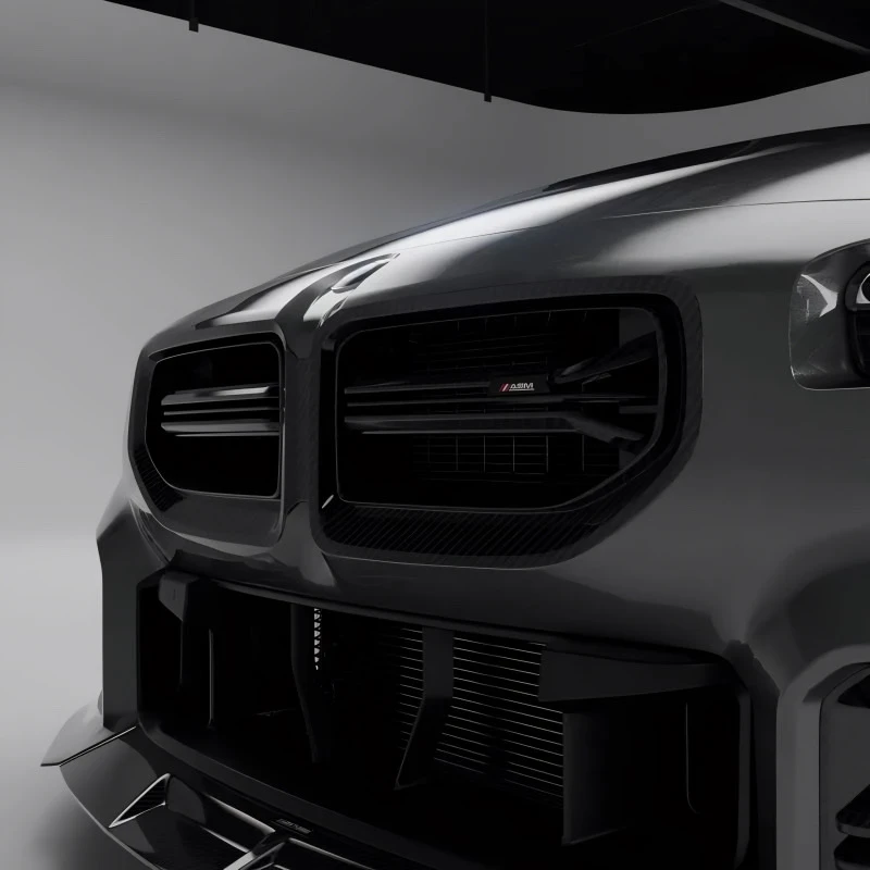 Carbon fibre front grille with ASM badge viewed from right angle