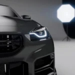 LED headlight detail next to carbon grille frame