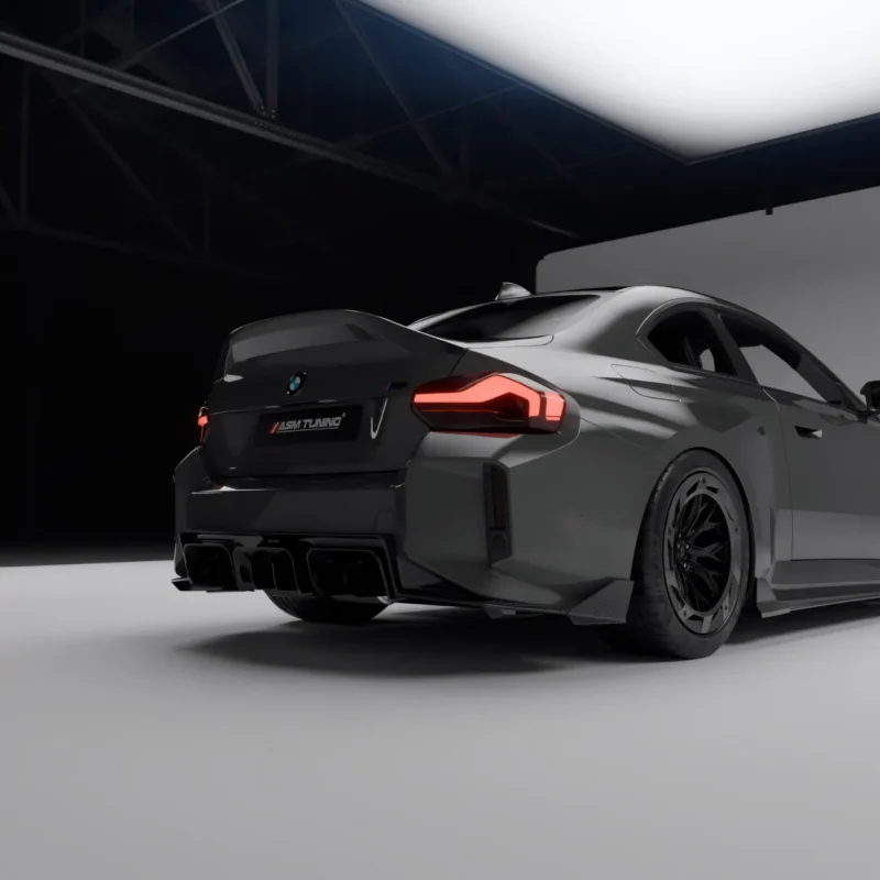 BMW G87 M2 rear side showing carbon ducktail spoiler