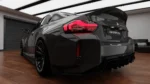 bme g87 m2 dry carbon rear spoiler profile close up showing high kick ducktail shape and refined OEM+ integration