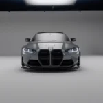 Studio front shot of grey BMW G82/G83 M4 showcasing ASM carbon fibre bumper ducts