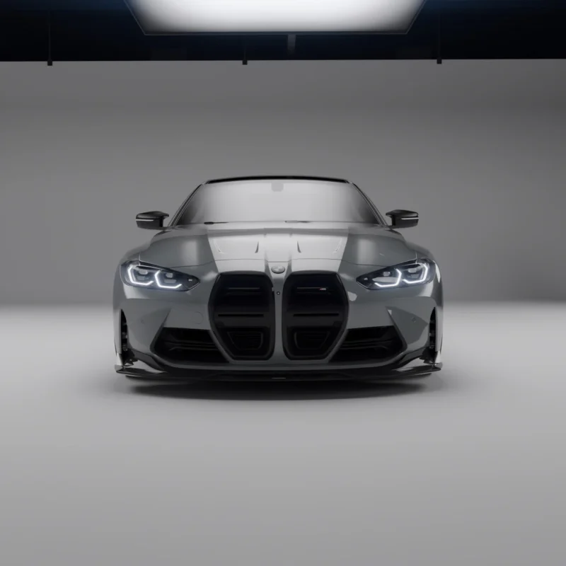 Studio front shot of grey BMW G82/G83 M4 showcasing ASM carbon fibre bumper ducts