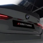 Low-angle rear shot of BMW M4 G82 trunk featuring ASM spoiler and ASM Tuning license plate branding