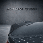 Angled rear quarter view of grey BMW M4 G82 showing the ASM pre-preg carbon fibre trunk lip spoiler installed