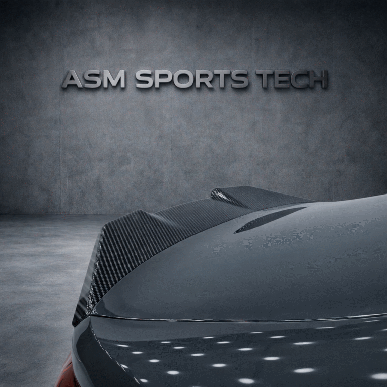 Angled rear quarter view of grey BMW M4 G82 showing the ASM pre-preg carbon fibre trunk lip spoiler installed