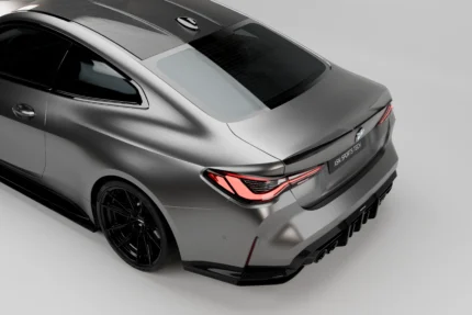 BMW M4 G82 and G22 carbon rear spoiler side profile showing OEM+ trunk lip integration