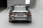 BMW M4 G82 and 4 Series G22 pre-preg carbon fibre spoiler fitment detail showing boot lid alignment