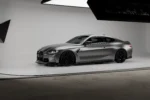 BMW M4 G82 G83 carbon side skirt extensions rear side angle showing lower side integration toward rear diffuser