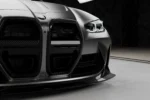 BMW M4 G82 G83 dry pre-preg carbon front splitter lower detail showing technical front lip profile and gloss carbon finish