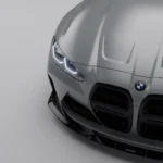 Close-up of left headlight and dry carbon splitter detail on BMW M4 G82/G83