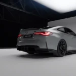 Low rear close-up of carbon fibre diffuser installed on grey BMW M4 G82