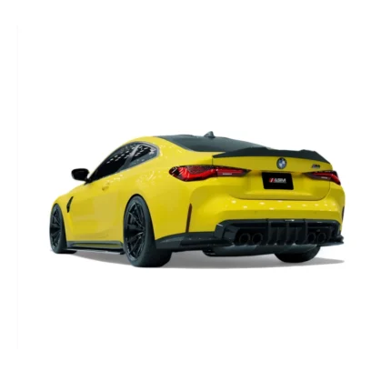 Side rear angle of yellow BMW M4 G82 with ASM carbon fibre diffuser fitted
