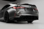 BMW M4 G82 G83 dry carbon fibre rear diffuser lower detail showing technical rear aero profile and gloss carbon finish