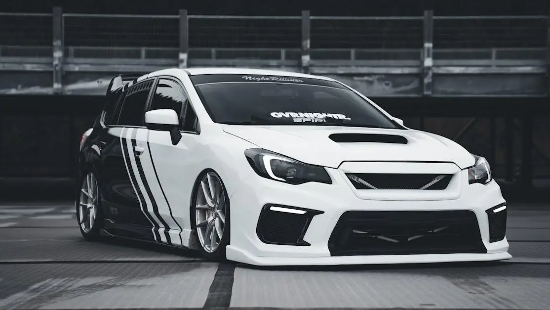 White sports car with black stripes showcasing aggressive vs functional fitment customizations.