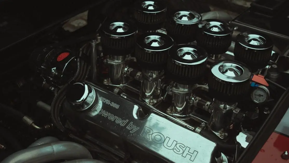 High-performance car engine showing how to install an oil catch can with air filters and chrome detailing.