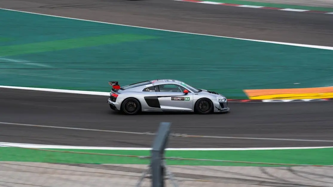 Racing car on track to reduce turbo lag during competition.