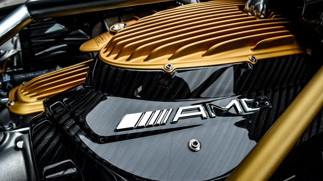 Luxury car engine with carbon fiber and gold accents, highlighting best cold air intake design.
