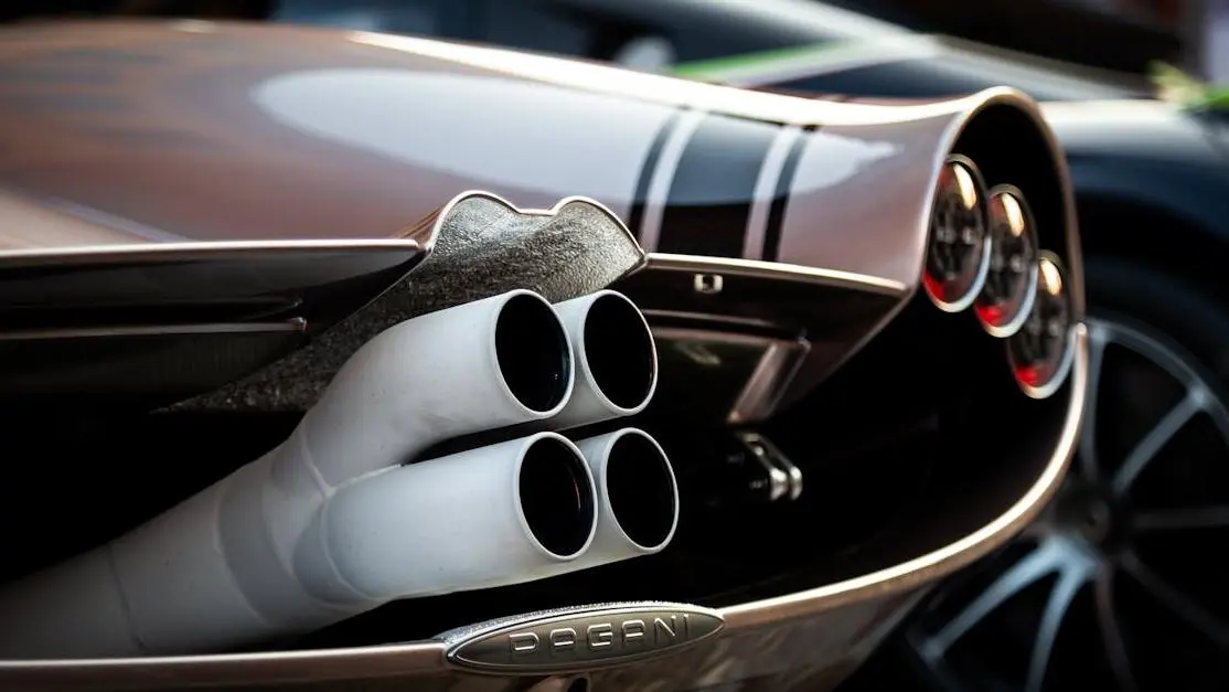 Pagani hypercar with best exhaust systems at car exhibition.