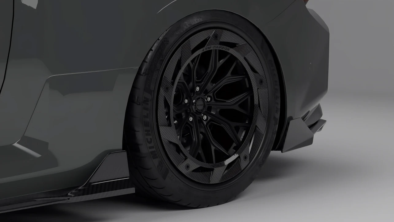 Close-up of ASM Forged wheel, installed on a performance car, showing carbon fibre details - Forged vs Flow-Formed vs Cast Wheels comparison 2025