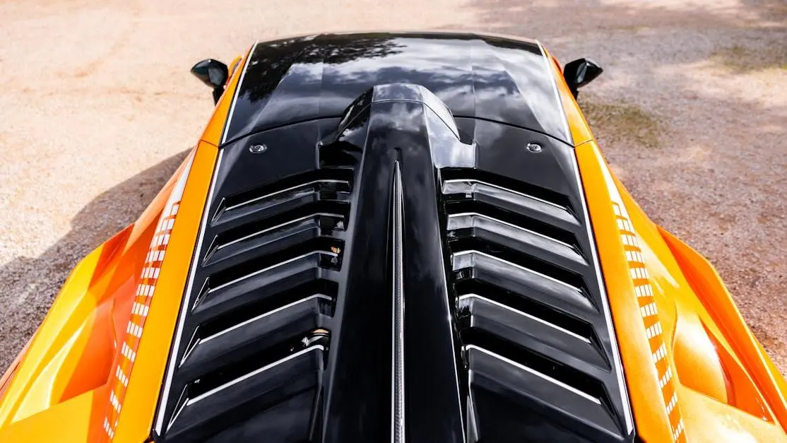 Orange Lamborghini Huracan STO with vented hood, illustrating how to install hood vents.