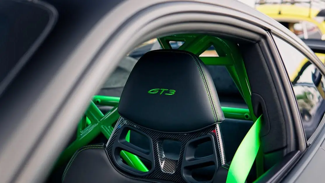 GT3 sports car seat with green accents for "how to install racing seats" guide.