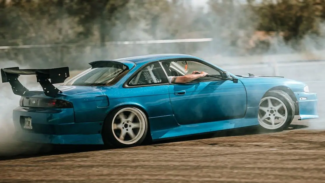 Nissan Silvia S14 drifting on track for "how to install sway bars" guide.