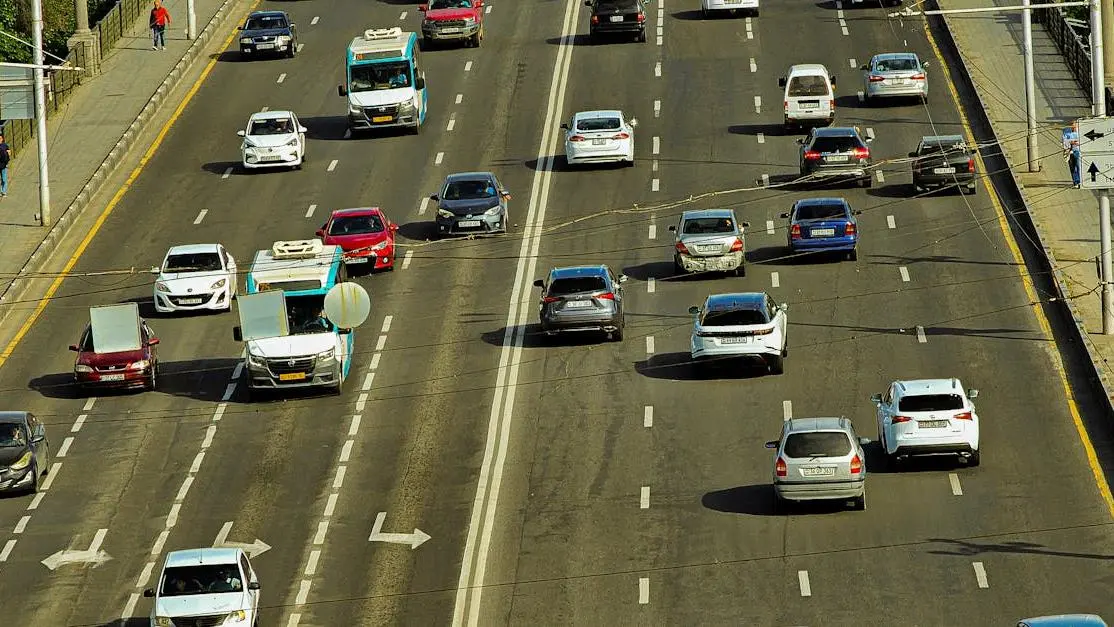 Urban highway with cars, illustrating city transportation and effects of welded diff daily driving.