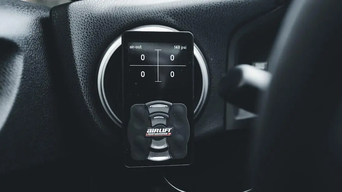 Airlift Performance controller on dashboard, illustrating best boost controllers for turbo cars.