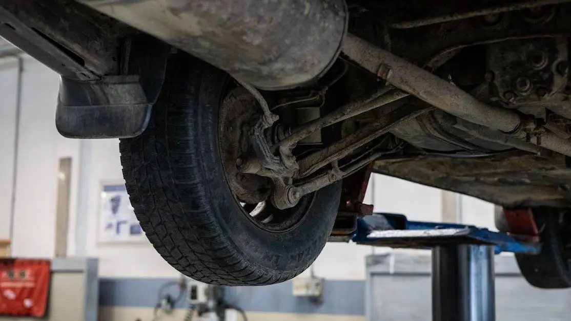Car undercarriage showing air suspension vs coilovers, highlighting pros and cons comparison