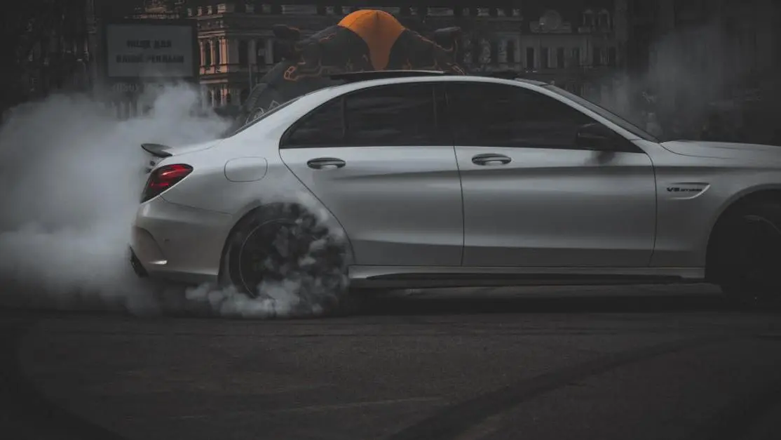 Sports car drifting with smoke, illustrating tuning for pops and bangs performance effects