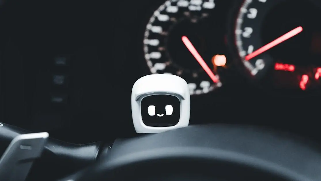 Modern automotive accessories: futuristic robot gadget displayed on car dashboard