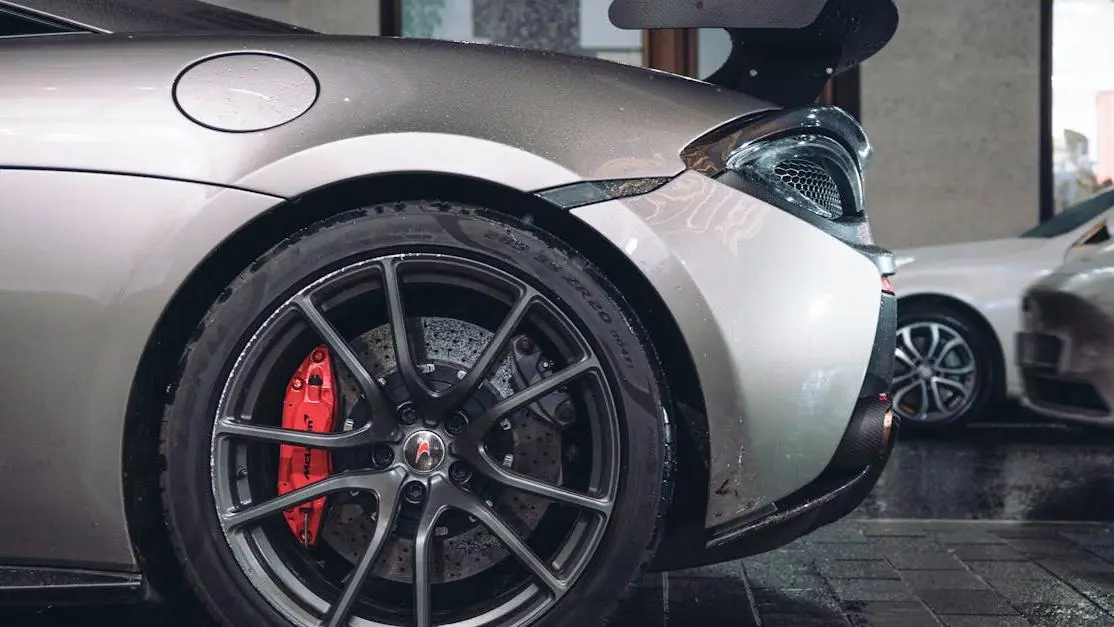 Luxury sports car with custom wheel and spoiler highlighting car customizations on a city street