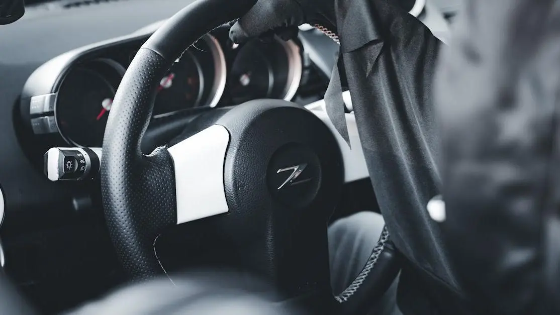 Sports car interior with driver, representing car performance stores near me.