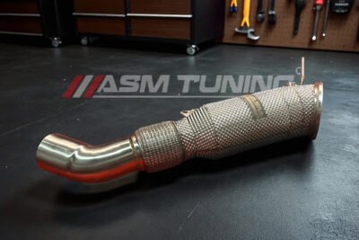 Beginner’s Guide: The First 5 Car Mods That Actually Work Mechanic Installing Performance Downpipe Upgrade