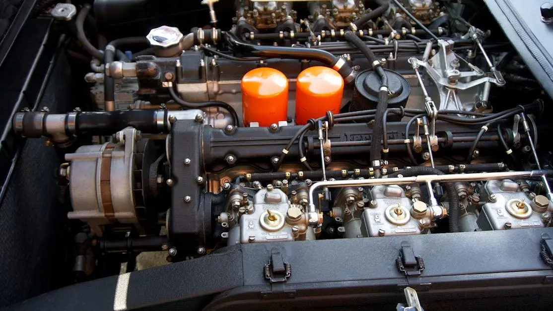 Sports car engine close-up highlighting advanced vehicle performance parts and engineering details.