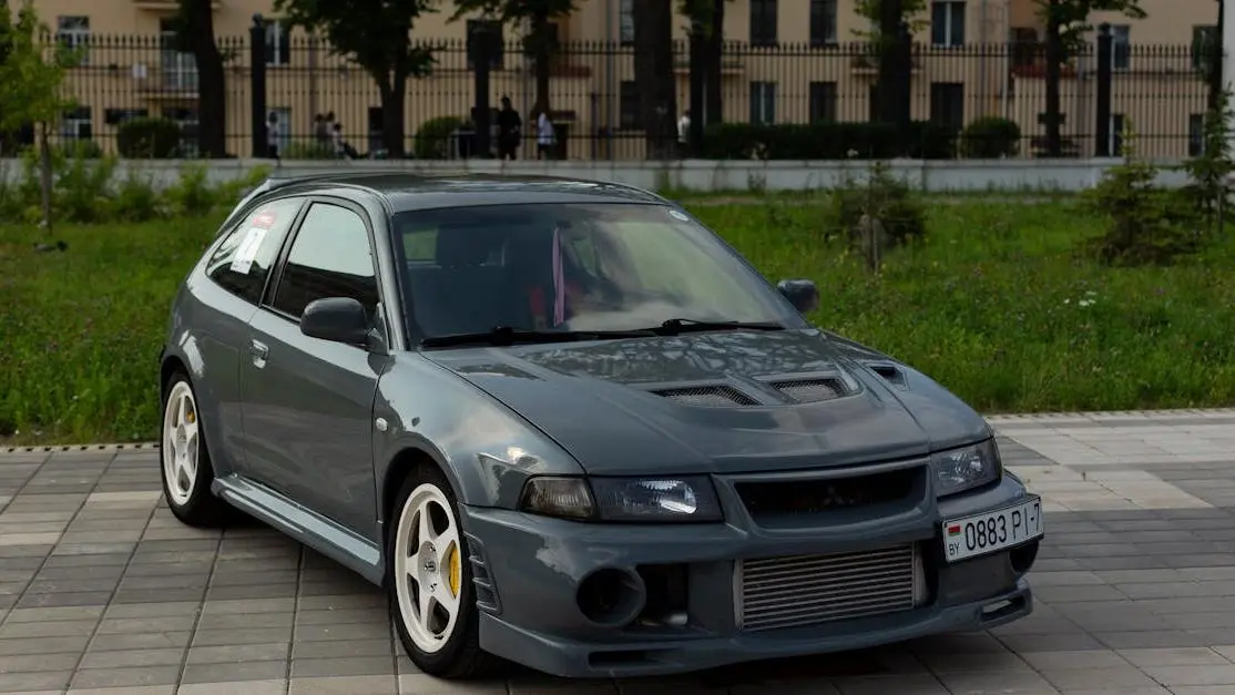 Body kit for Mitsubishi Eclipse on a custom hatchback, city street in Minsk, Belarus