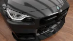 BMW G87 M2 carbon fibre front bumper intake grilles showing sharper front-end detail and dry carbon finish
