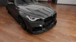 BMW G87 M2 dry carbon fibre front splitter by ASM Sports Tech showing OEM+ lower front bumper integration