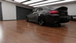 BMW G87 M2 dry carbon fibre side skirt fitment detail showing precise OEM+ lower sill alignment